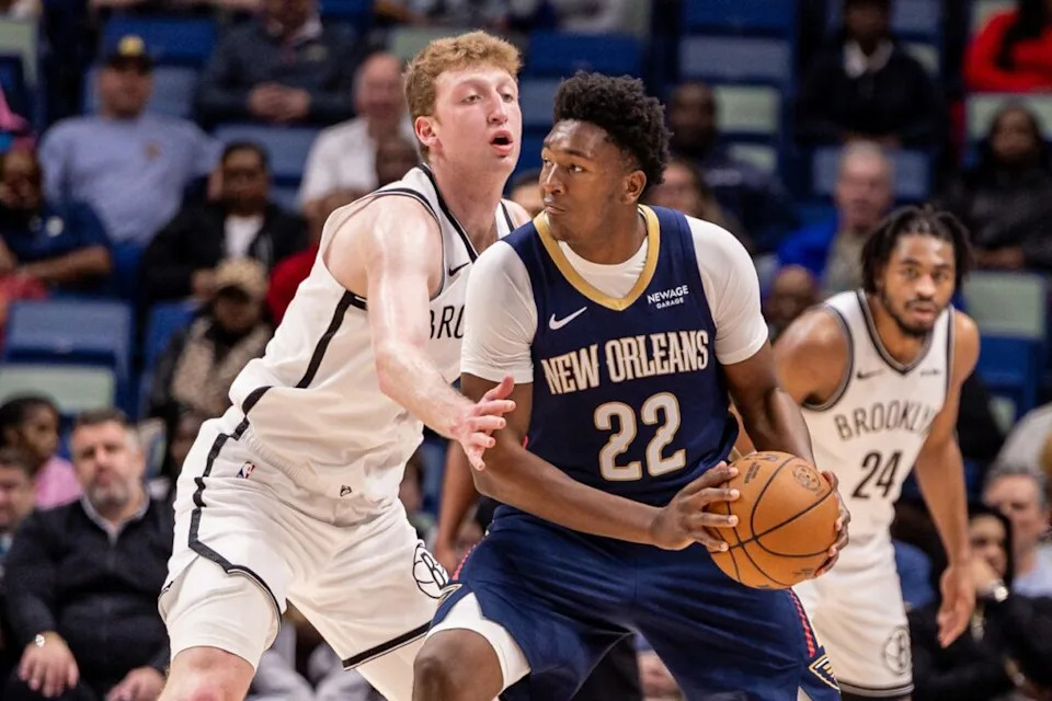 Jan 14, 2026; New Orleans, Louisiana, USA; New Orleans Pelicans center Derik Queen (22) dribbles against Brooklyn Nets forward Danny Wolf (2) during the first half at Smoothie King Center. Mandatory Credit: Stephen Lew-Imagn Images