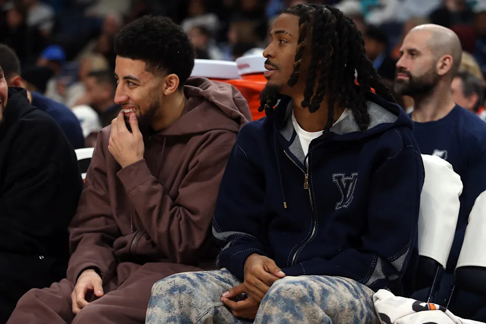 Jan 11, 2026; Memphis, Tennessee, USA; Memphis Grizzlies guard Scotty Pippen Jr. (left) and guard Ja Morant (right) looks on during the second quarter against the Brooklyn Nets at FedExForum. Mandatory Credit: Petre Thomas-Imagn Images