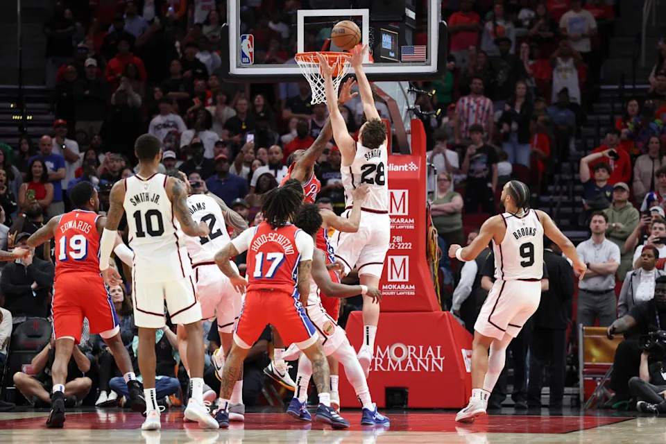 Mar 17, 2025; Houston, Texas, USA; Houston Rockets center Alperen Sengun (28) gets a put back on a missed free throw attempt by forward Jabari Smith Jr. (10) into the basket to tie the game in the final seconds of the fourth quarter against the Philadelphia 76ers at Toyota Center. Mandatory Credit: Troy Taormina-Imagn Images