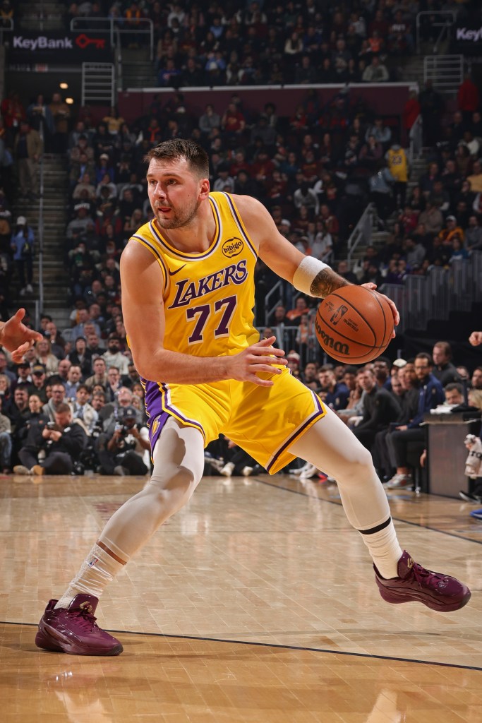 Luka Doncic #77 of the Los Angeles Lakers dribbles the ball during the game against the Cleveland Cavaliers.