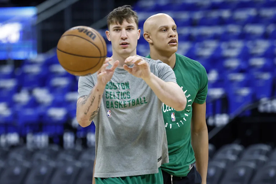 Orlando, FL – April 25: Boston Celtics forward Baylor Scheierman, left, and guard Jordan Walsh participate in the team shoot-around before Game 3 of the NBA Eastern Conference playoffs against the Orlando Magic at the Kia Center. (Photo by Danielle Parhizkaran/The Boston Globe via Getty Images)