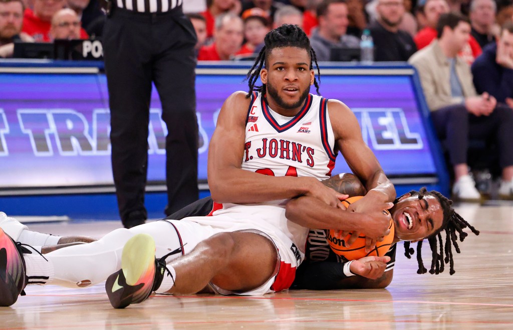 Zuby Ejiofor of the St. John's Red Storm and Jamier Jones of the Providence Friars fight for control of the ball.