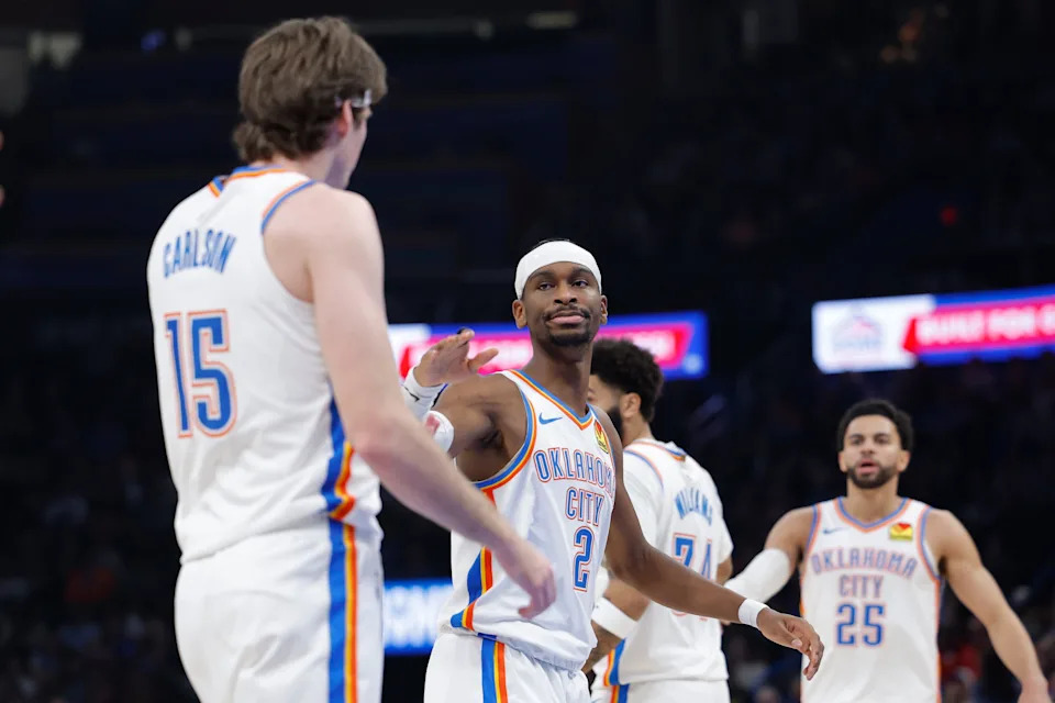 Jan 5, 2026; Oklahoma City, Oklahoma, USA; Oklahoma City Thunder guard Shai Gilgeous-Alexander (2) high fives center Branden Carlson (15) after a play against the Charlotte Hornets during the second quarter at Paycom Center. Mandatory Credit: Alonzo Adams-Imagn Images