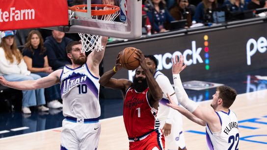 Los Angeles Clippers Guard James Harden (1) attacks the rim of three defenders and scores during an NBA basketball game against the Utah Jazz, Thursday January 1st, 2026 in Inglewood, California.