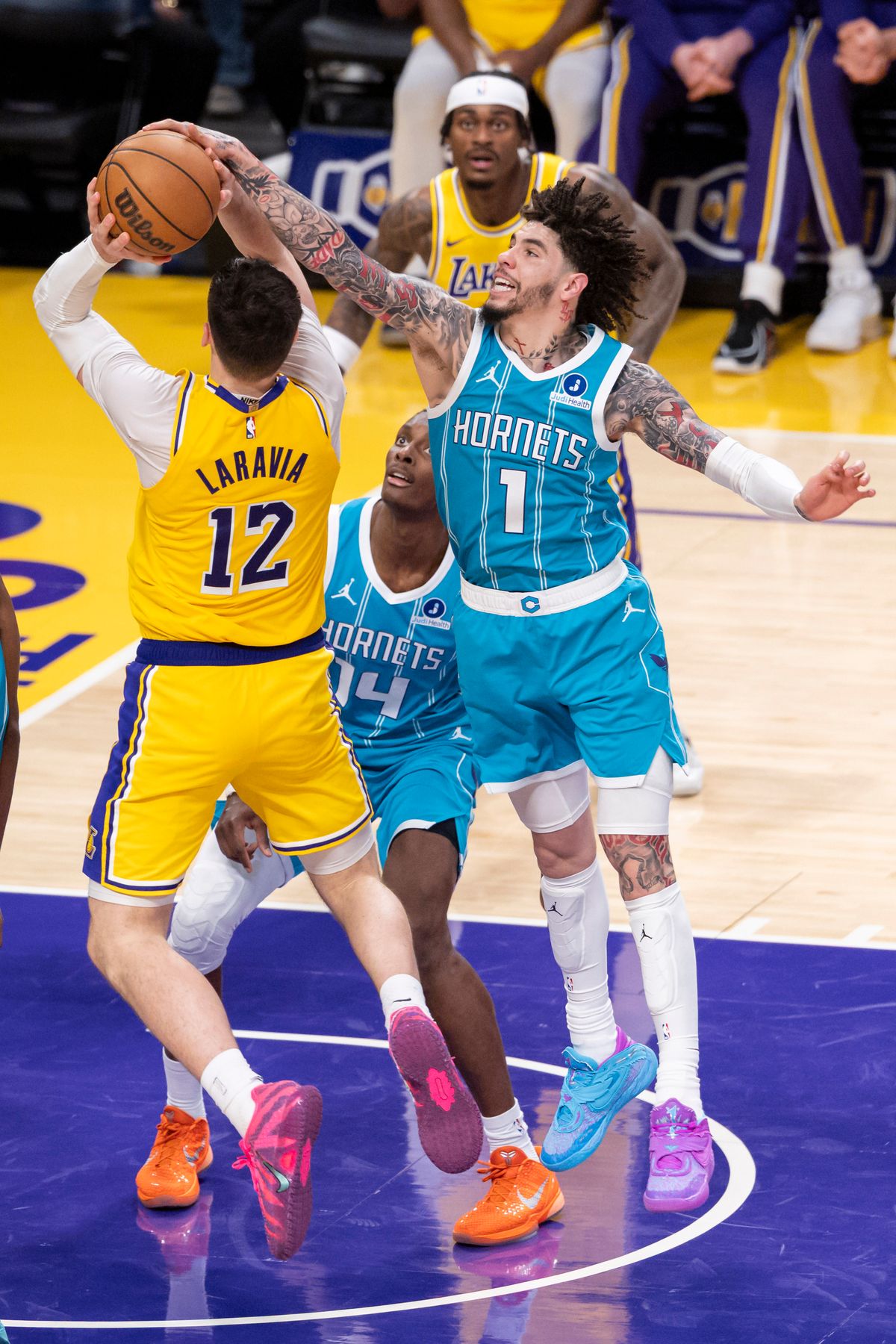 LaMelo Ball #1 of the Charlotte Hornets blocks the shot by Jake LaRavia #12 of the Los Angeles Lakers during an NBA basketball game, Thursday January 15, 2026 in Inglewood, Calif.