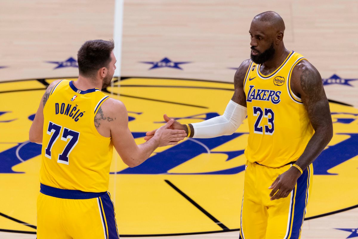 LeBron James #23 and Luka Doncic #77 of the Los Angeles Lakers high five during an NBA basketball game against the Charlotte Hornets, Thursday January 15, 2026 in Inglewood, Calif.