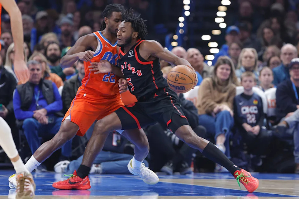 Jan 25, 2026; Oklahoma City, Oklahoma, USA; Toronto Raptors guard Immanuel Quickley (5) drives to the basket against Oklahoma City Thunder guard Cason Wallace (22) during the first quarter at Paycom Center. Mandatory Credit: Alonzo Adams-Imagn Images