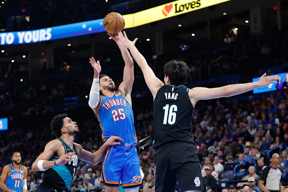 Dec 31, 2025; Oklahoma City, Oklahoma, USA; Oklahoma City Thunder guard Ajay Mitchell (25) shoots over Portland Trail Blazers center Yang Hansen (16) during the second half at Paycom Center. Mandatory Credit: Alonzo Adams-Imagn Images