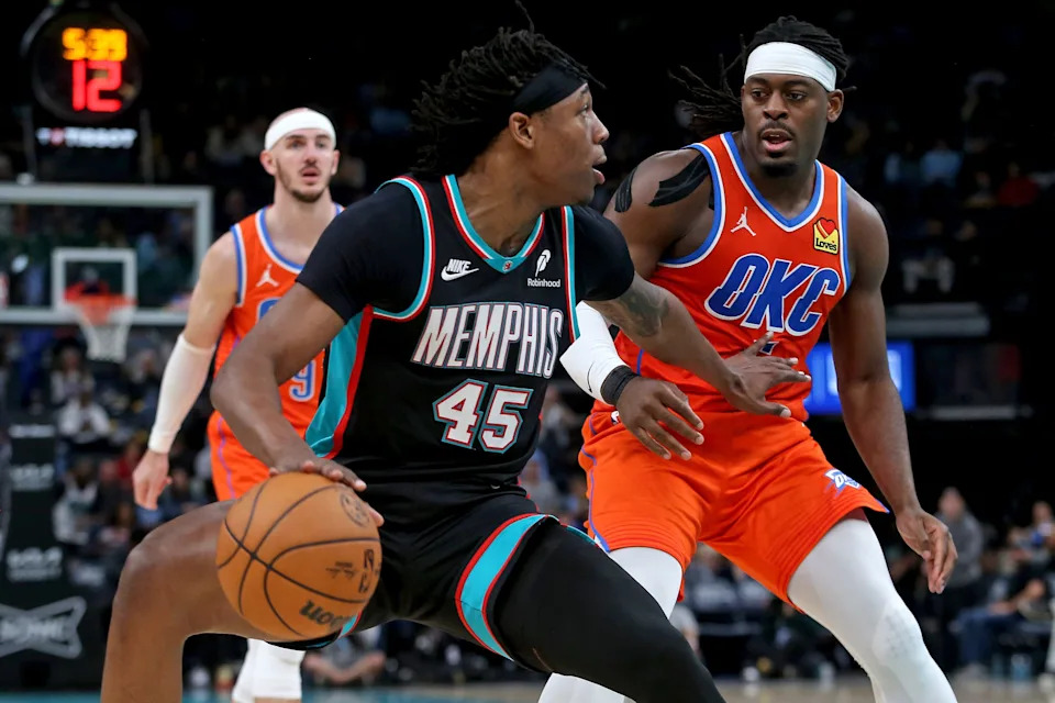 Jan 9, 2026; Memphis, Tennessee, USA; Memphis Grizzlies forward GG Jackson II (45) dribbles as Oklahoma City Thunder guard Luguentz Dort (5) defends during the fourth quarter at FedExForum. Mandatory Credit: Petre Thomas-Imagn Images