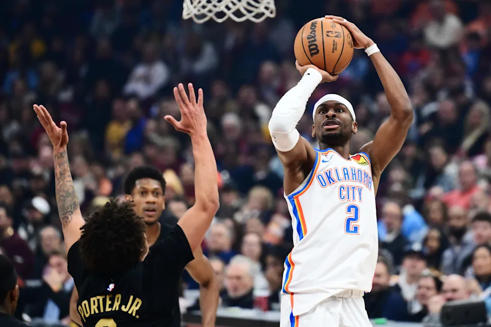 Jan 19, 2026; Cleveland, Ohio, USA; Oklahoma City Thunder guard Shai Gilgeous-Alexander (2) shoots over the defense of Cleveland Cavaliers guard Craig Porter Jr. (9) during the first half at Rocket Arena. Mandatory Credit: Ken Blaze-Imagn Images