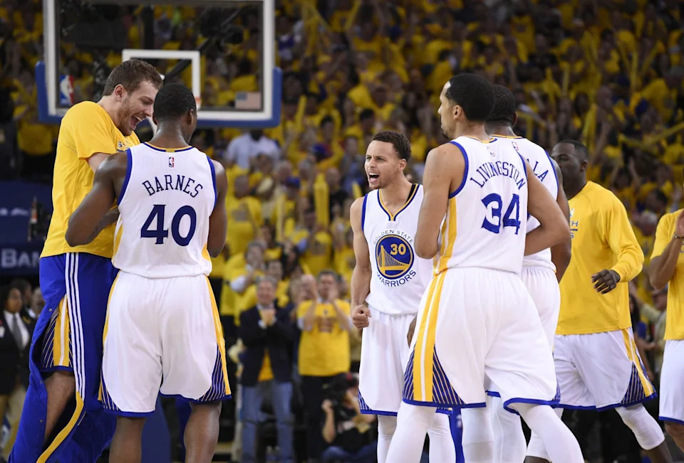 May 27, 2015; Oakland, CA, USA; Golden State Warriors forward Harrison Barnes (40) and guard Shaun Livingston (34) and guard Stephen Curry (30) react during the fourth quarter against the Houston Rockets in game five of the Western Conference Finals of the NBA Playoffs. at Oracle Arena. Mandatory Credit: Kyle Terada-USA TODAY Sports