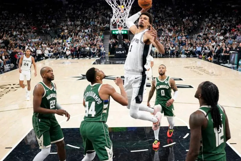Jan 31, 2025; San Antonio, Texas, USA; San Antonio Spurs center Victor Wembanyama (1) dunks over Milwaukee Bucks forward Giannis Antetokounmpo (34) during the second half at Frost Bank Center. Mandatory Credit: Scott Wachter-Imagn Images