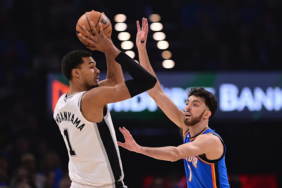OKLAHOMA CITY, OKLAHOMA - JANUARY 13: Victor Wembanyama #1 of the San Antonio Spurs handles the ball in front of Chet Holmgren #7 of the Oklahoma City Thunder during the first half at Paycom Center on January 13, 2026 in Oklahoma City, Oklahoma. NOTE TO USER: User expressly acknowledges and agrees that, by downloading and or using this photograph, User is consenting to the terms and conditions of the Getty Images License Agreement. (Photo by Joshua Gateley/Getty Images)