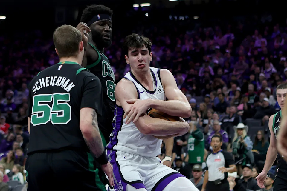 Jan 1, 2026; Sacramento, California, USA; Sacramento Kings center Maxine Raynaud (42) secures the rebound against the Boston Celtics during the second quarter at Golden 1 Center. Mandatory Credit: Dennis Lee-Imagn Images