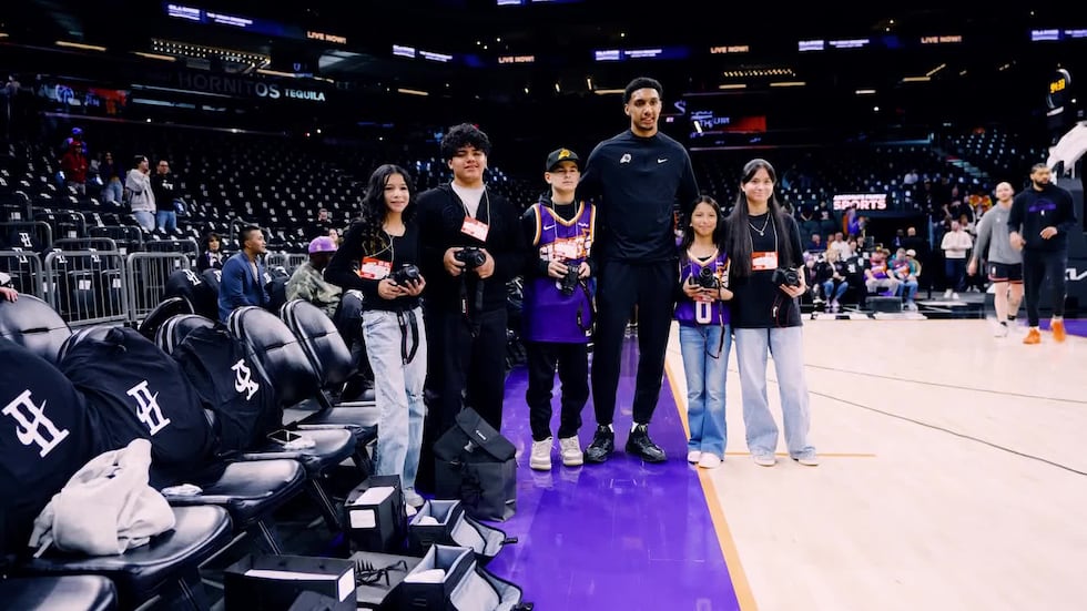 Suns forward Ryan Dunn, who is a fan of photography himself, welcomed the young fans and...