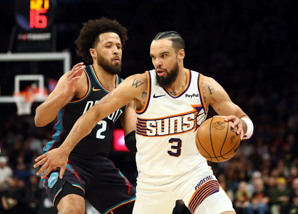 Detroit Pistons guard Cade Cunningham (2) defends against Phoenix Suns forward Dillon Brooks (3) in the first half at Mortgage Matchup Center in Phoenix on Thursday, Jan. 29, 2026.