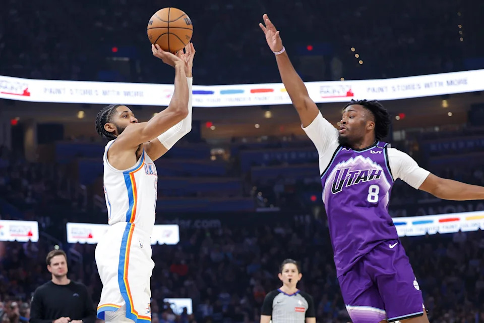 Jan 7, 2026; Oklahoma City, Oklahoma, USA; Oklahoma City Thunder guard Isaiah Joe (11) shoots as Utah Jazz guard Isaiah Collier (8) defends during the second quarter at Paycom Center. Mandatory Credit: Alonzo Adams-Imagn Images