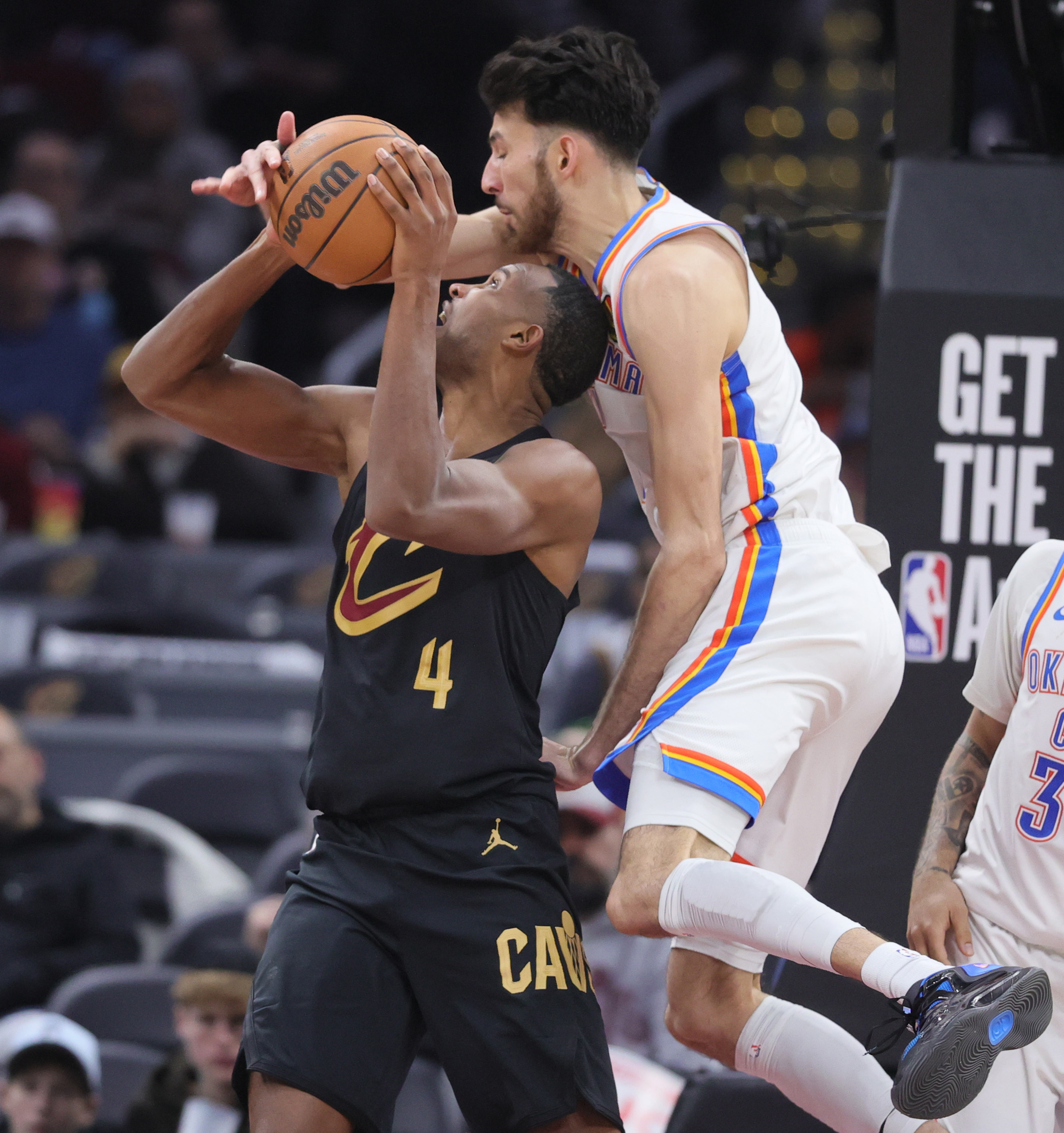 Cleveland Cavaliers center Evan Mobley goes up for a shot attempt guarded by Oklahoma City Thunder center Chet Holmgren in the second half.