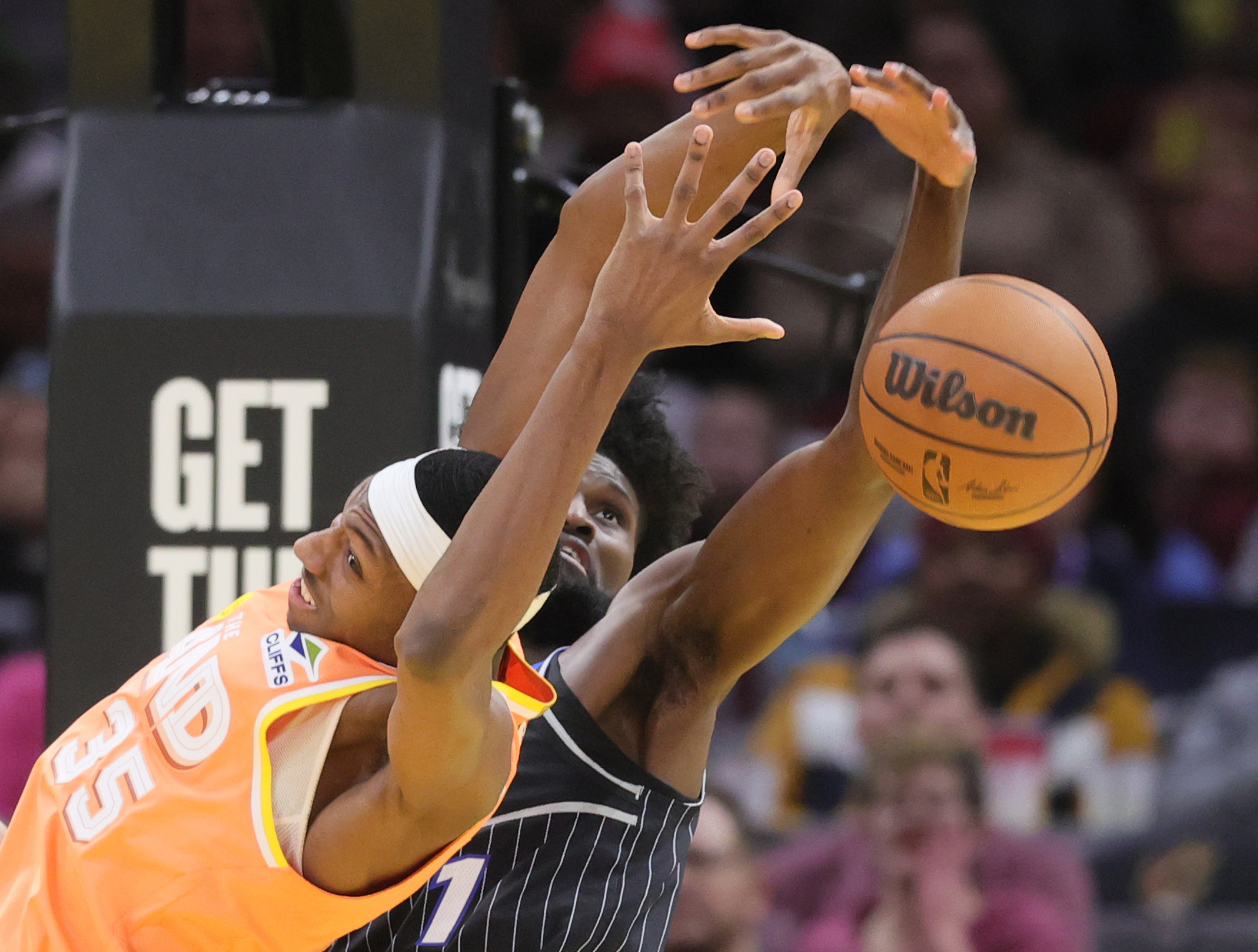 Cleveland Cavaliers forward Nae'qwan Tomlin (L) and Orlando Magic forward Jonathan Isaac battle for possession of a rebound in the second half. 