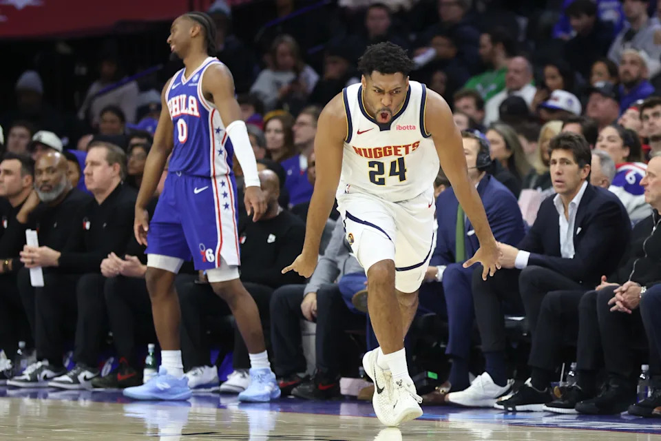Jan 5, 2026; Philadelphia, Pennsylvania, USA; Denver Nuggets guard Jalen Pickett (24) reacts to his three pointer in front of Philadelphia 76ers guard Tyrese Maxey (0) during the second quarter at Xfinity Mobile Arena. Mandatory Credit: Bill Streicher-Imagn Images