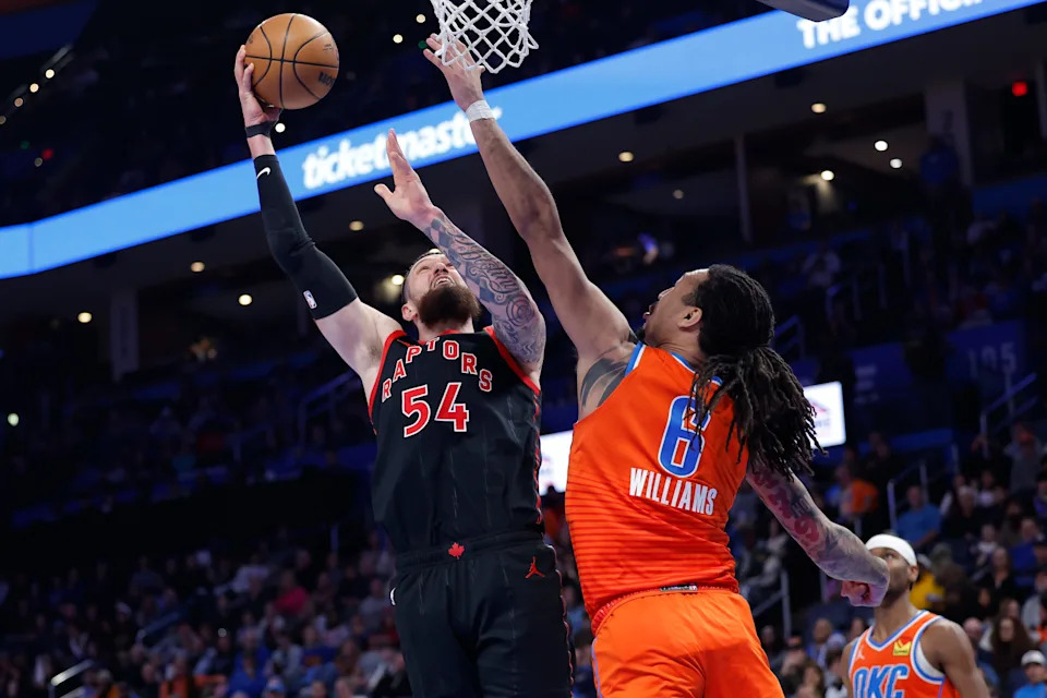 Jan 25, 2026; Oklahoma City, Oklahoma, USA; Toronto Raptors forward/center Sandro Mamukelashvili (54) goes up for a basket as Oklahoma City Thunder forward Jaylin Williams (6) defends during the second half at Paycom Center. Mandatory Credit: Alonzo Adams-Imagn Images