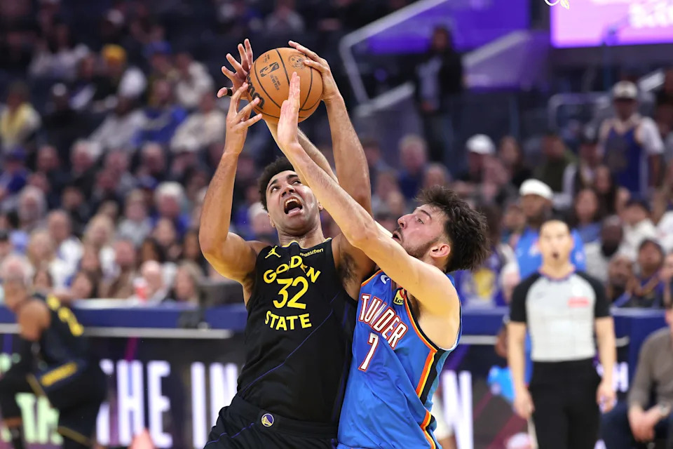 SAN FRANCISCO, CALIFORNIA - JANUARY 02: Trayce Jackson-Davis #32 of the Golden State Warriors goes up for a shot on Chet Holmgren #7 of the Oklahoma City Thunder during the first half at Chase Center on January 02, 2026 in San Francisco, California. NOTE TO USER: User expressly acknowledges and agrees that, by downloading and/or using this photograph, user is consenting to the terms and conditions of the Getty Images License Agreement. (Photo by Ezra Shaw/Getty Images)