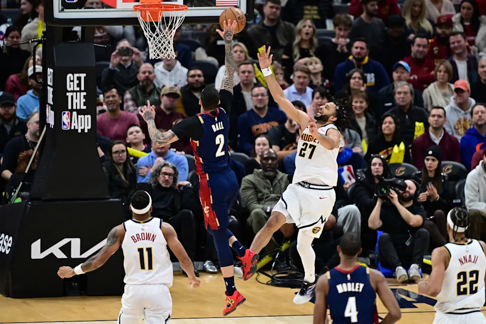 Cleveland Cavaliers guard Lonzo Ball (2) blocks a shot by Denver Nuggets guard Jamal Murray (27) on Jan. 2, 2026, in Cleveland.