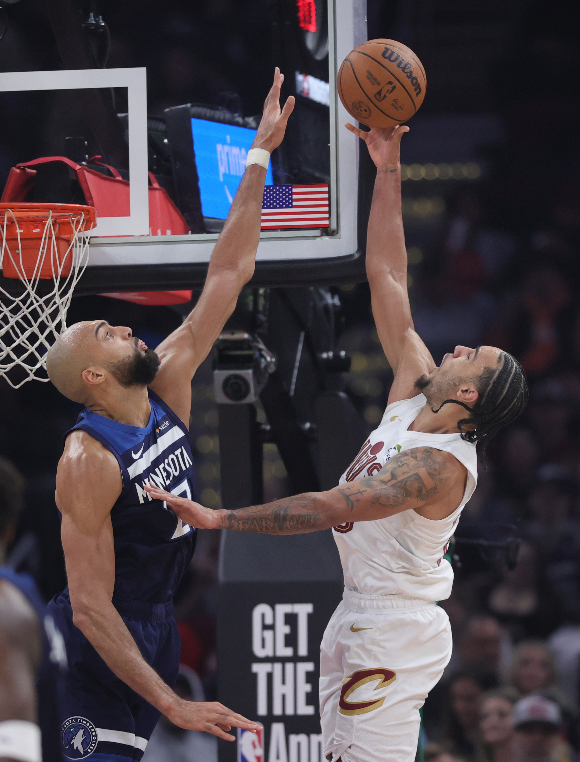 Cleveland Cavaliers guard Tyrese Proctor goes for a shot attempt guarded by Minnesota Timberwolves center Rudy Gobert in the first half at Rocket Arena. 