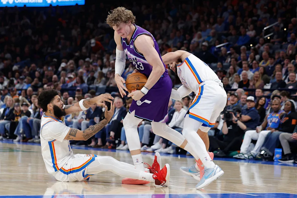 Jan 7, 2026; Oklahoma City, Oklahoma, USA; Utah Jazz forward/center Lauri Markkanen (23) fights for control of the ball against Oklahoma City Thunder guard/forward Kenrich Williams (34) and guard Ajay Mitchell (25) during the second half at Paycom Center. Mandatory Credit: Alonzo Adams-Imagn Images