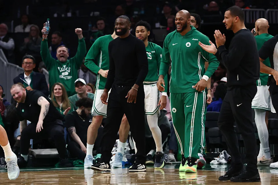 Jan 30, 2026; Boston, Massachusetts, USA; Boston Celtics guard Jaylen Brown (7) (in street clothes) smiles after a Celtic basket during the second quarter against the Sacramento Kings at TD Garden. Mandatory Credit: Winslow Townson-Imagn Images