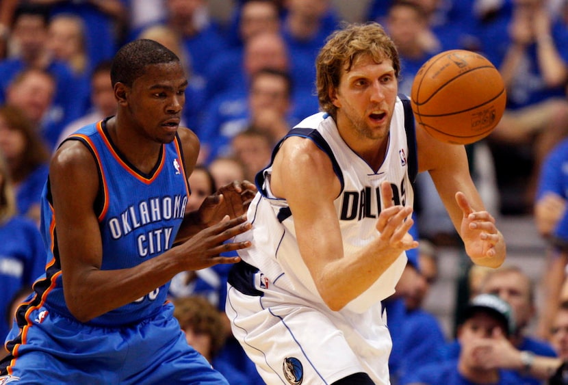Dallas Mavericks power forward Dirk Nowitzki (41) receives the ball as he is defended by...