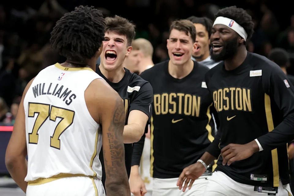 Jan 23, 2026; Brooklyn, New York, USA; Boston Celtics forward Amari Williams (77) celebrates with teammates after defeating the Brooklyn Nets in double overtime at Barclays Center. Mandatory Credit: Brad Penner-Imagn Images