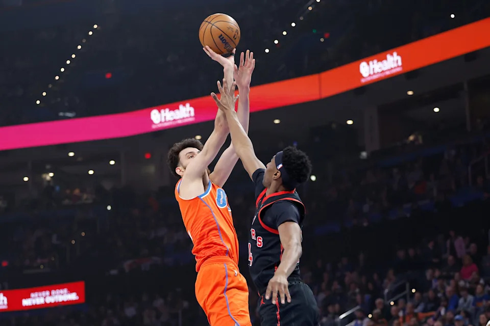Jan 25, 2026; Oklahoma City, Oklahoma, USA; Oklahoma City Thunder center/forward Chet Holmgren (7) shoots over Toronto Raptors guard Ja'kobe Walter (14) during the first quarter at Paycom Center. Mandatory Credit: Alonzo Adams-Imagn Images