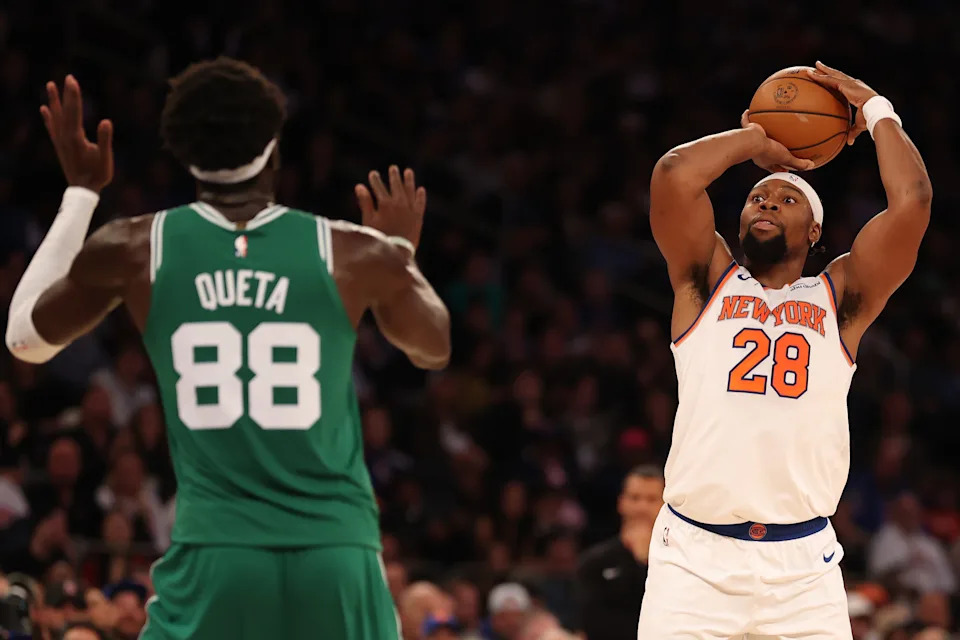 NEW YORK, NEW YORK - OCTOBER 24: Guerschon Yabusele #28 of the New York Knicks shoots against Neemias Queta #88 of the Boston Celtics during the second quarter at Madison Square Garden on October 24, 2025 in New York City. NOTE TO USER: User expressly acknowledges and agrees that, by downloading and or using this photograph, User is consenting to the terms and conditions of the Getty Images License Agreement. (Photo by Al Bello/Getty Images)