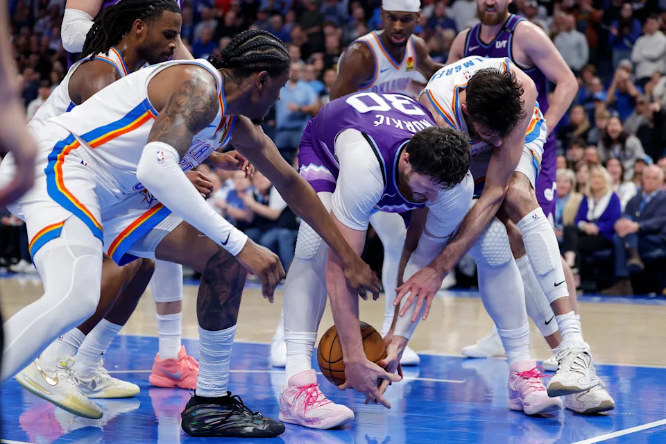 Jan 7, 2026; Oklahoma City, Oklahoma, USA; Utah Jazz center Jusuf Nurkić (30), Oklahoma City Thunder guard/forward Jalen Williams (8) and center/forward Chet Holmgren (7) fight for a loose ball during the second half at Paycom Center. Mandatory Credit: Alonzo Adams-Imagn Images
