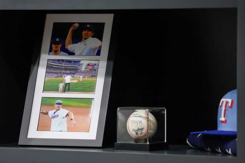 Various baseball related memorabilia is seen on a shelf in Dallas Mavericks head coach Jason...