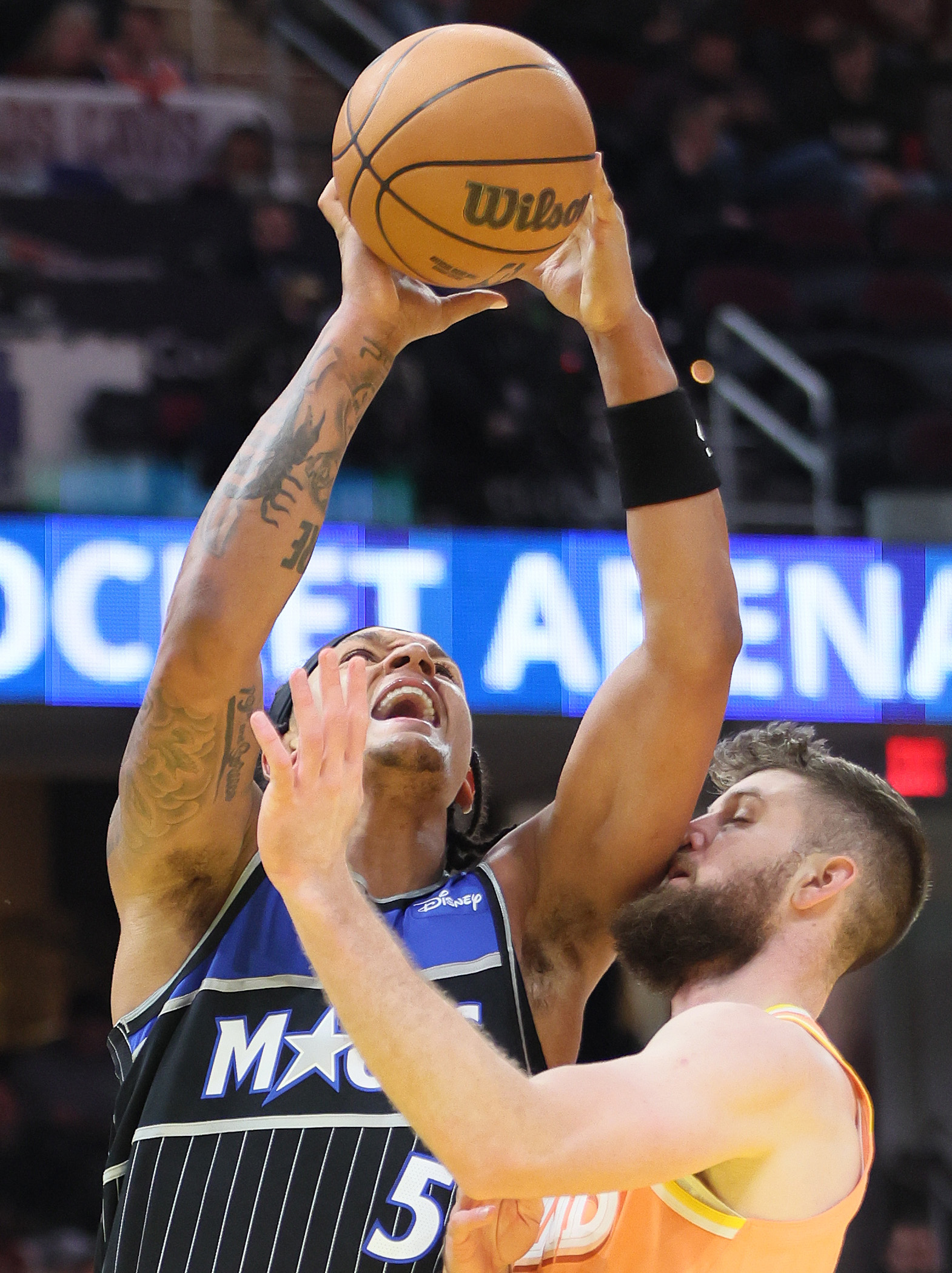 Orlando Magic forward Paolo Banchero goes up for a shot attempt guarded by Cleveland Cavaliers forward Dean Wade in the second half. 