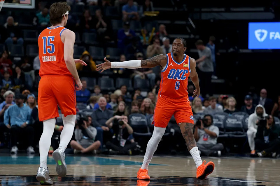 Jan 9, 2026; Memphis, Tennessee, USA; Oklahoma City Thunder guard Jalen Williams (8) reacts with center Branden Carlson (15) during the first quarter against the Memphis Grizzlies at FedExForum. Mandatory Credit: Petre Thomas-Imagn Images