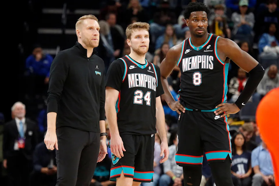Jan 9, 2026; Memphis, Tennessee, USA; Memphis Grizzlies head coach Tuomas Iisalo (left), guard Cam Spencer (24) and forward/center Jaren Jackson Jr. (8) looks on during the fourth quarter against the Oklahoma City Thunder at FedExForum. Mandatory Credit: Petre Thomas-Imagn Images