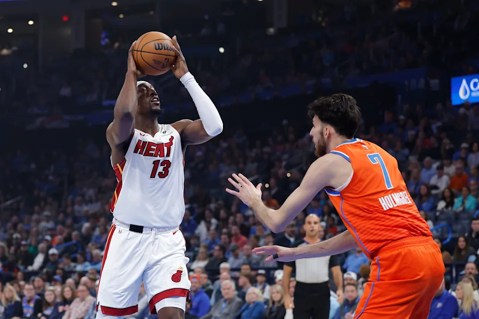 Jan 11, 2026; Oklahoma City, Oklahoma, USA; Miami Heat center/forward Bam Adebayo (13) drives to the basket against Oklahoma City Thunder center/forward Chet Holmgren (7) during the first quarter at Paycom Center. Mandatory Credit: Alonzo Adams-Imagn Images