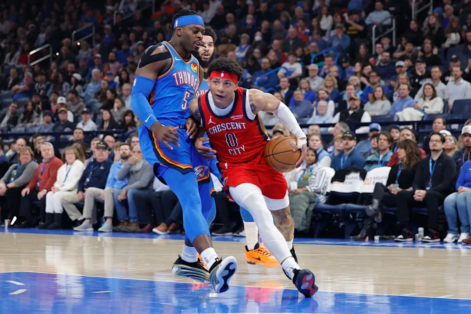 Jan 27, 2026; Oklahoma City, Oklahoma, USA; New Orleans Pelicans guard Jeremiah Fears (0) drives past Oklahoma City Thunder guard Luguentz Dort (5) during the second quarter at Paycom Center. Mandatory Credit: Alonzo Adams-Imagn Images