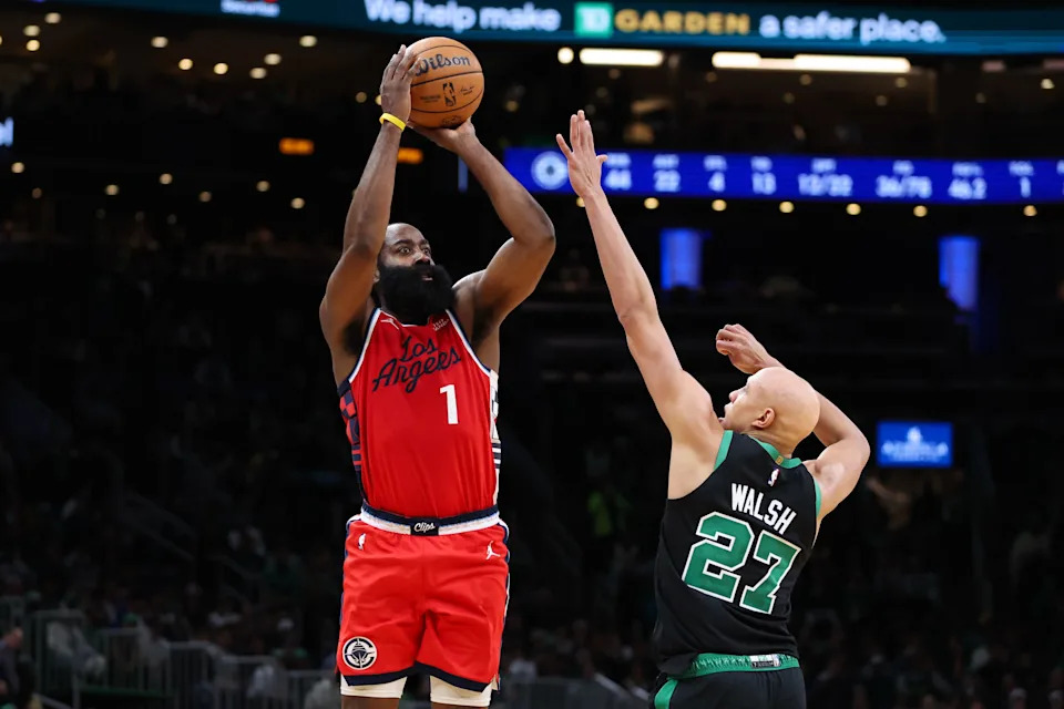 Nov 16, 2025; Boston, Massachusetts, USA; Los Angeles Clippers guard James Harden (1) shoots defended by Boston Celtics forward Jordan Walsh (27) during the second half at TD Garden. Mandatory Credit: Paul Rutherford-Imagn Images
