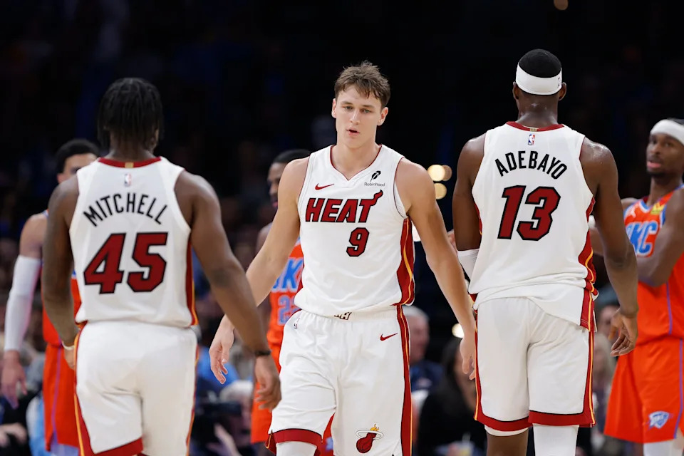 Jan 11, 2026; Oklahoma City, Oklahoma, USA; Miami Heat guard Davion Mitchell (45), guard Pelle Larsson (9), and center/forward Bam Adebayo (13) stand after a play against the Oklahoma City Thunder during the second half at Paycom Center. Mandatory Credit: Alonzo Adams-Imagn Images