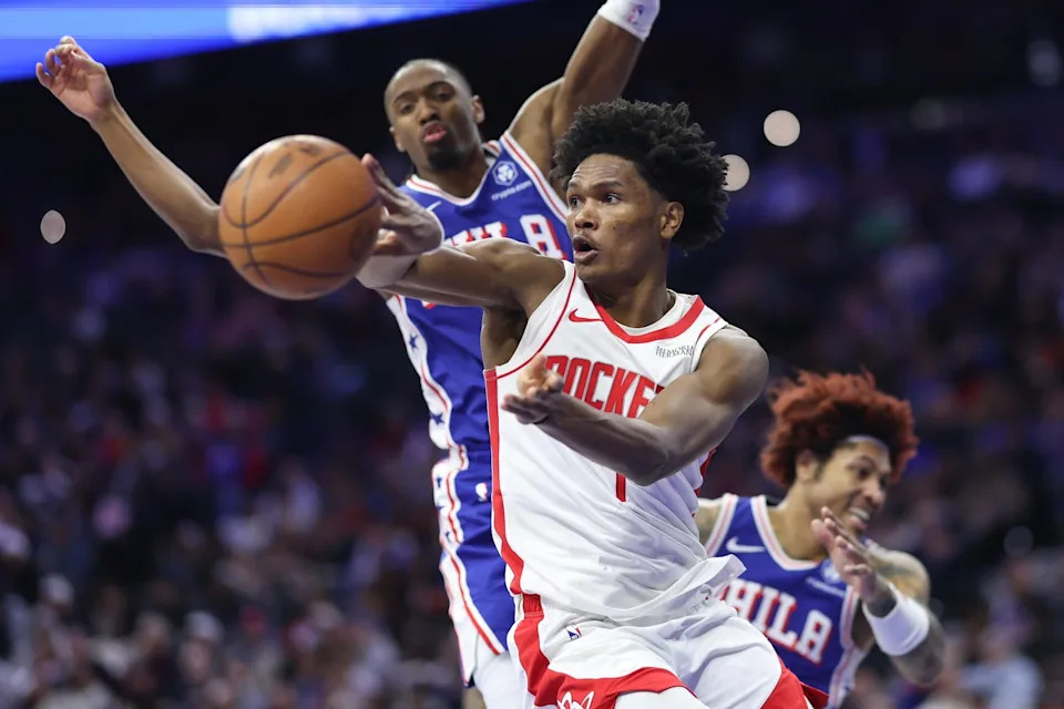 Jan 22, 2026; Philadelphia, Pennsylvania, USA; Houston Rockets guard Amen Thompson (1) passes the ball in front of Philadelphia 76ers guard Tyrese Maxey (0) during the fourth quarter at Xfinity Mobile Arena. Mandatory Credit: Bill Streicher-Imagn Images