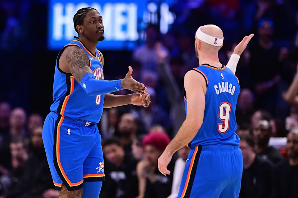 OKLAHOMA CITY, OKLAHOMA - JANUARY 13: Jalen Williams #8 and Alex Caruso #9 of the Oklahoma City Thunder high-five during the second half against the San Antonio Spurs at Paycom Center on January 13, 2026 in Oklahoma City, Oklahoma. NOTE TO USER: User expressly acknowledges and agrees that, by downloading and or using this photograph, User is consenting to the terms and conditions of the Getty Images License Agreement. (Photo by Joshua Gateley/Getty Images)