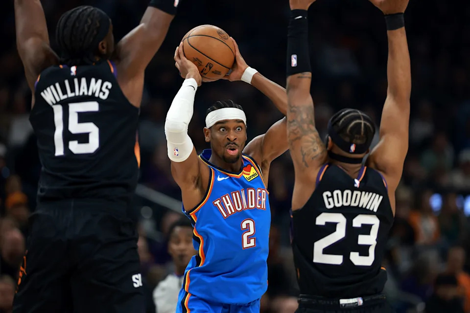 Jan 4, 2026; Phoenix, Arizona, USA; Oklahoma City Thunder guard Shai Gilgeous-Alexander (2) passes the ball against the Phoenix Suns in the first half at Mortgage Matchup Center. Mandatory Credit: Mark J. Rebilas-Imagn Images