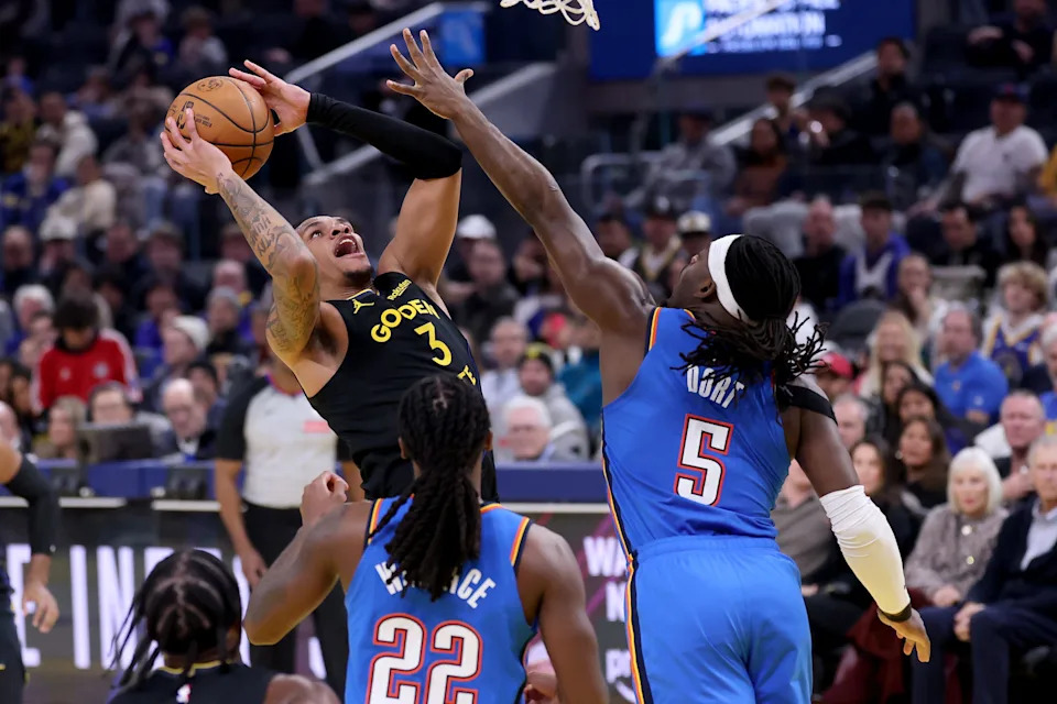 SAN FRANCISCO, CALIFORNIA - JANUARY 02: Will Richard #3 of the Golden State Warriors goes up for a shot on Luguentz Dort #5 of the Oklahoma City Thunder during the first half at Chase Center on January 02, 2026 in San Francisco, California. NOTE TO USER: User expressly acknowledges and agrees that, by downloading and/or using this photograph, user is consenting to the terms and conditions of the Getty Images License Agreement. (Photo by Ezra Shaw/Getty Images)