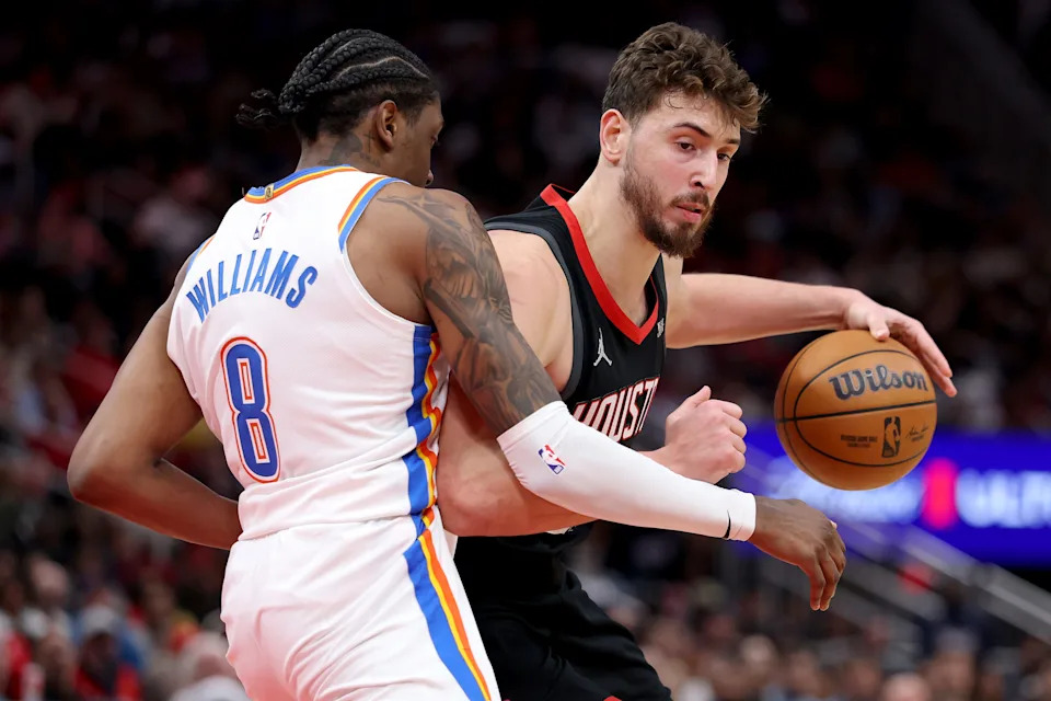 HOUSTON, TEXAS - JANUARY 15: Alperen Sengun #28 of the Houston Rockets in action during the second quarter of the game against Jalen Williams #8 of the Oklahoma City Thunder at Toyota Center on January 15, 2026 in Houston, Texas. (Photo by Kenneth Richmond/Getty Images)