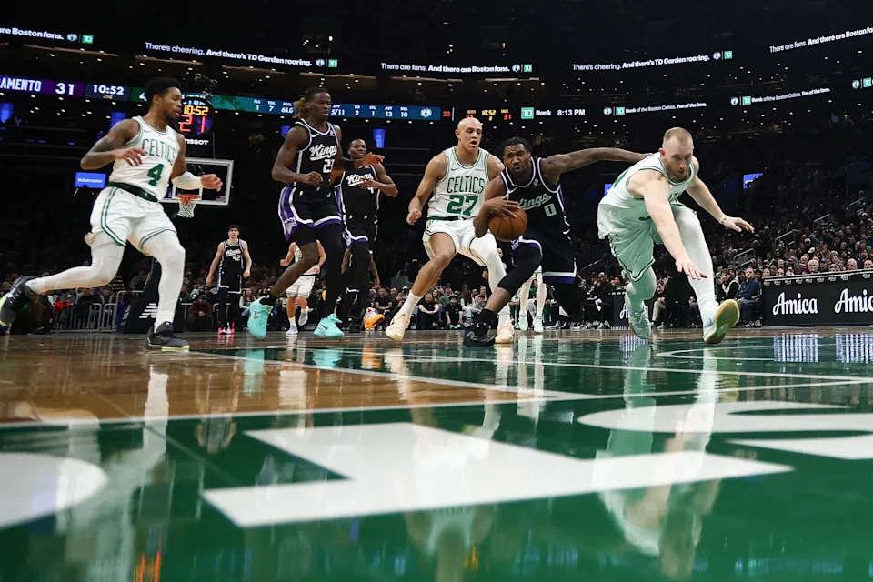 Jan 30, 2026; Boston, Massachusetts, USA; Sacramento Kings guard Malik Monk (0) drives past Boston Celtics guard Jordan Walsh (27) during the second quarter at TD Garden. Mandatory Credit: Winslow Townson-Imagn Images