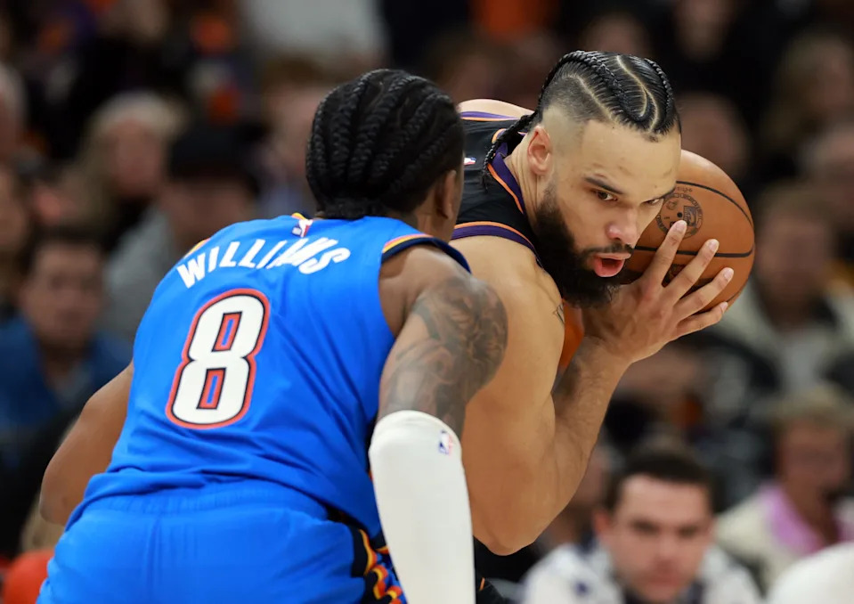Jan 4, 2026; Phoenix, Arizona, USA; Phoenix Suns forward Dillon Brooks (3) controls the ball against Oklahoma City Thunder guard Jalen Williams (8) in the second half at Mortgage Matchup Center. Mandatory Credit: Mark J. Rebilas-Imagn Images
